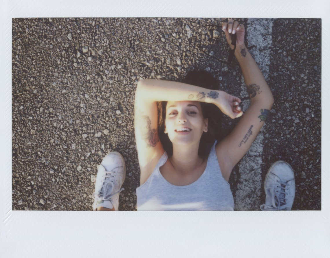 overhead: photographer shooting young woman