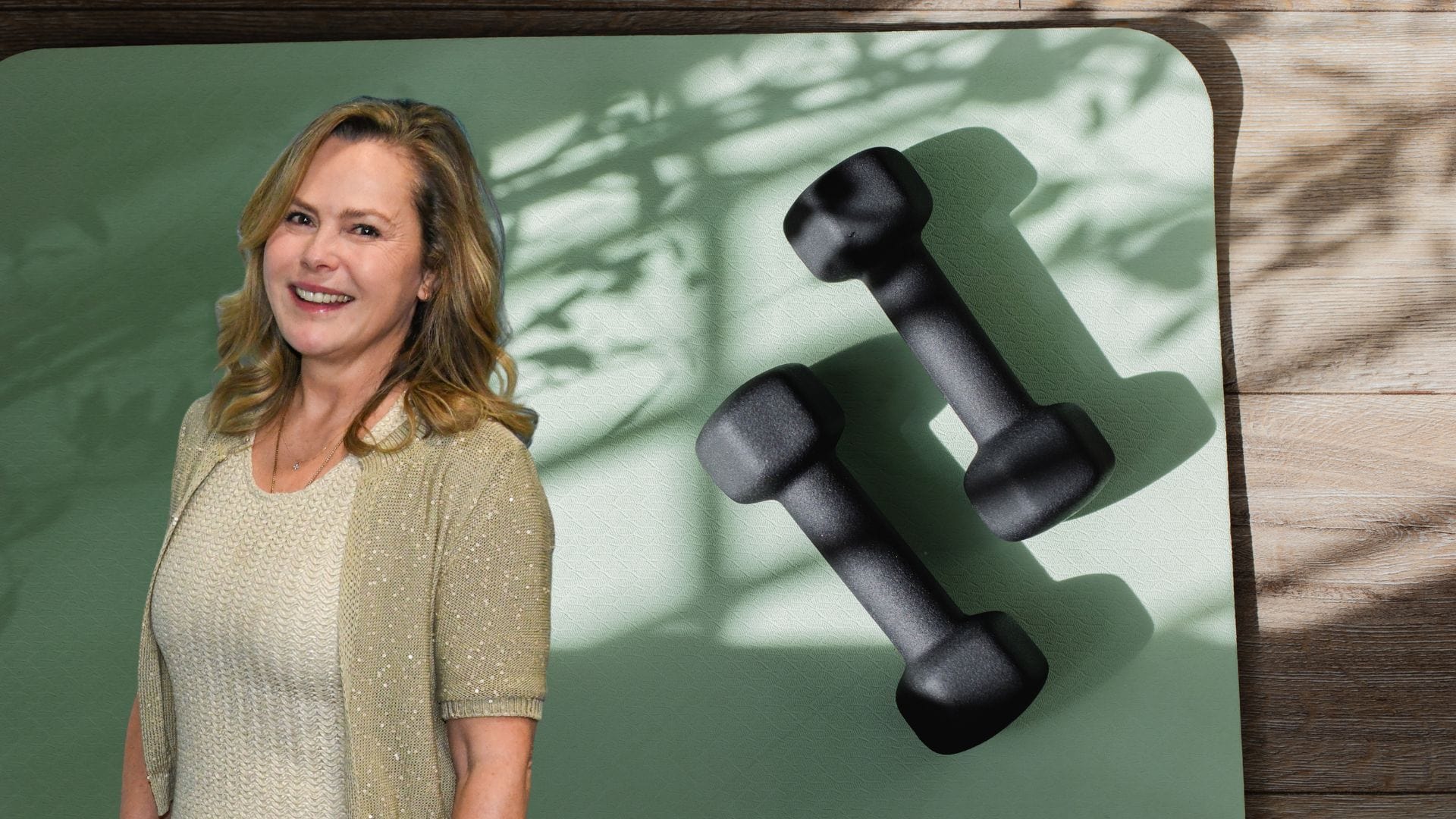 Liz Earle on a yoga mat next to dumbbells